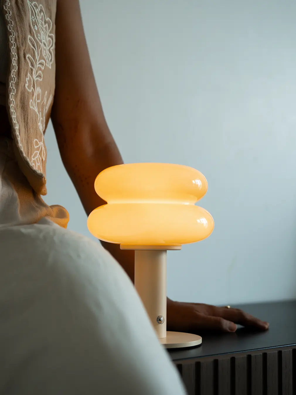 Yellow modern table lamp with soft warm light for cozy bedroom decor styling