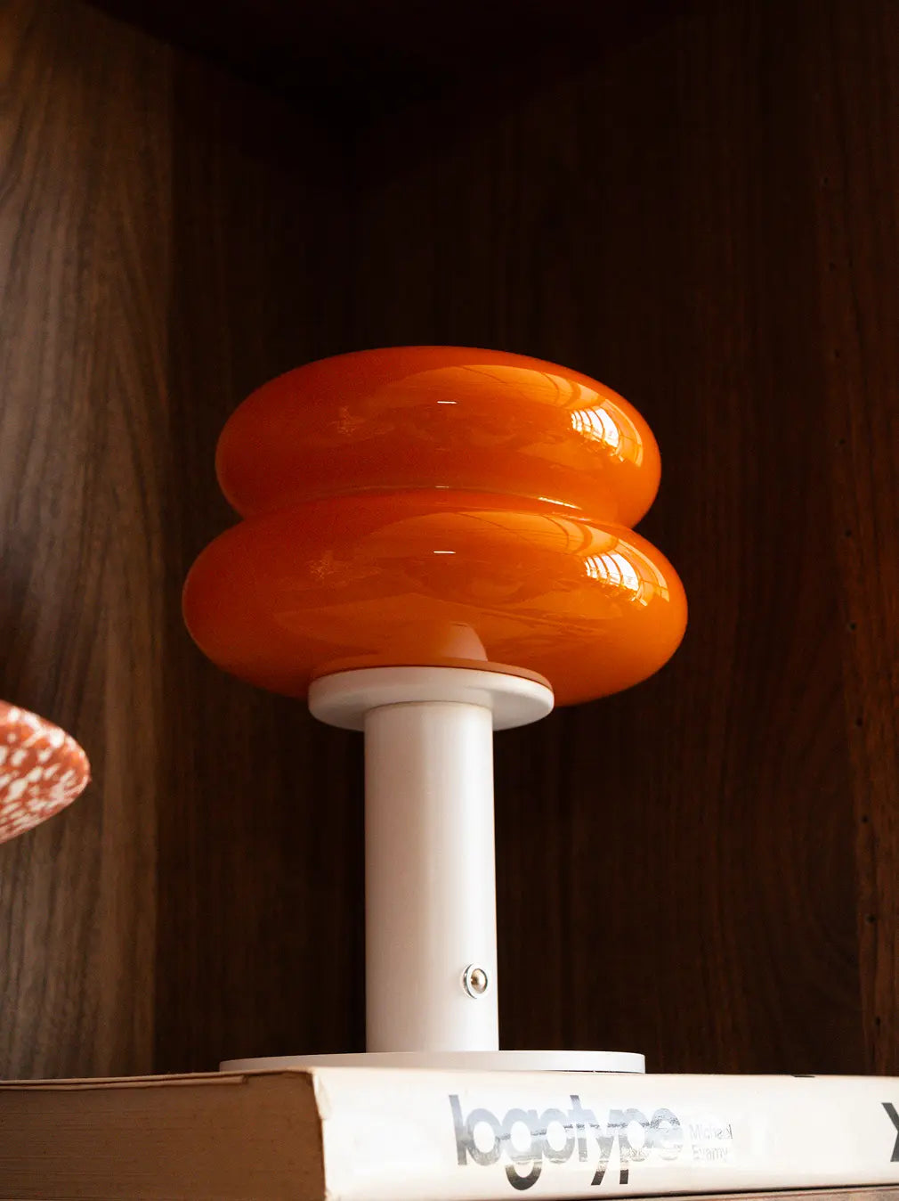 Orbit Orange Portable Table Lamp with glossy glass shade and white metal base