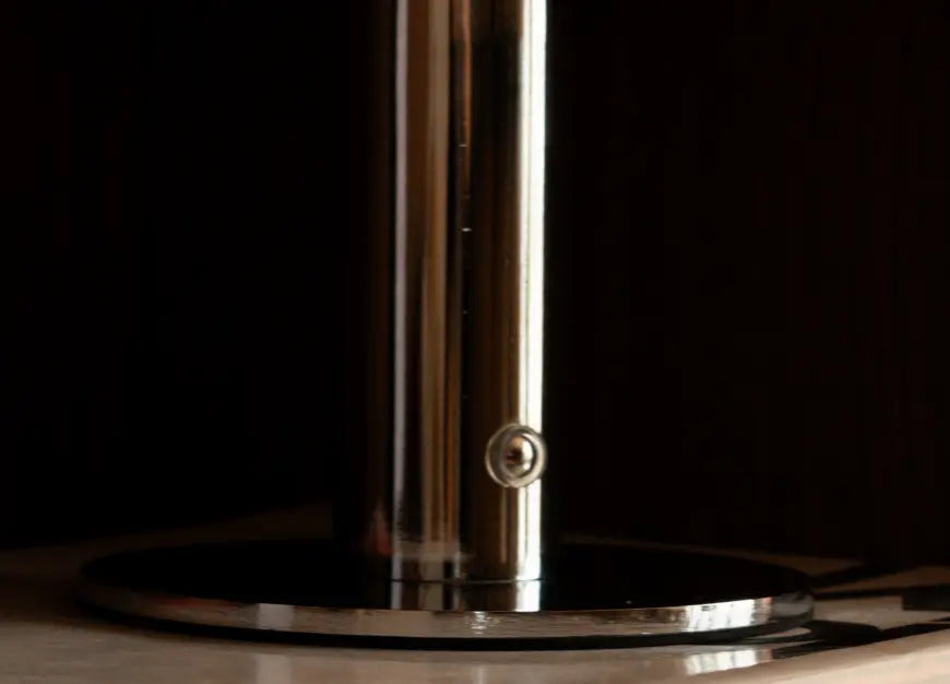 Close-up of Orbit Red portable table lamp chrome base with touch control