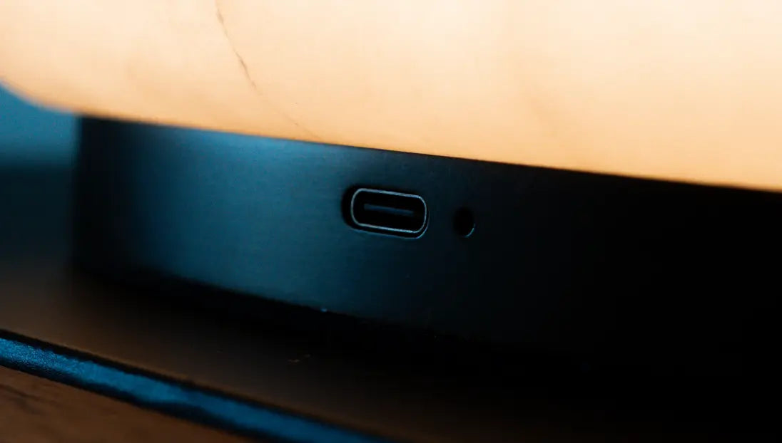 Type-C charging port on the Pebble Marble Portable Table Lamp metal base