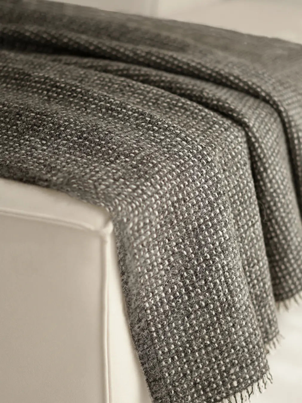 Textured Slate Angora throw blanket styled on sofa for cosy home decor