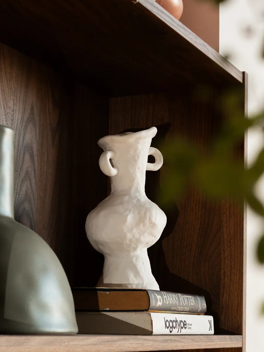 Suki Grand Ceramic Vase styled on shelf, sculptural white ceramic flower vase