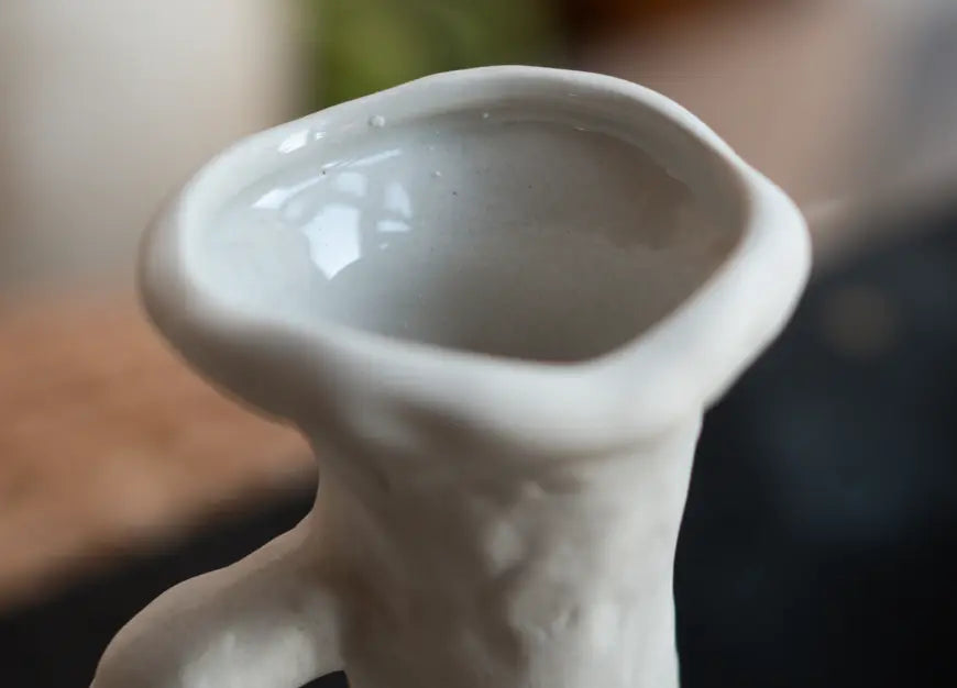 Close-up of glossy glazed rim of Suki Classic Ceramic Vase showing smooth interior.