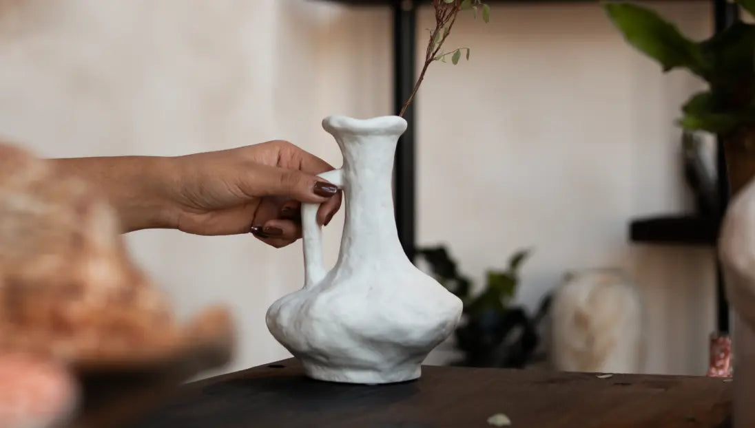 Hand holding Suki Classic Ceramic Vase showing size, balance, and sculptural form.