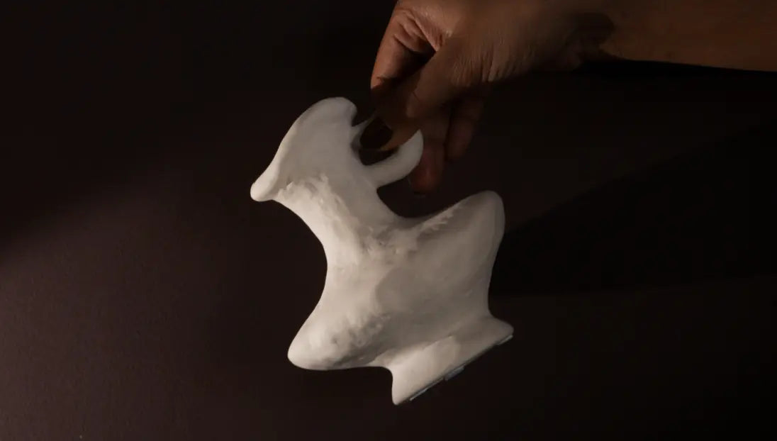 Handcrafted Suki Mini Ceramic Vase with rough pottery texture, highlighting its sculptural organic design.