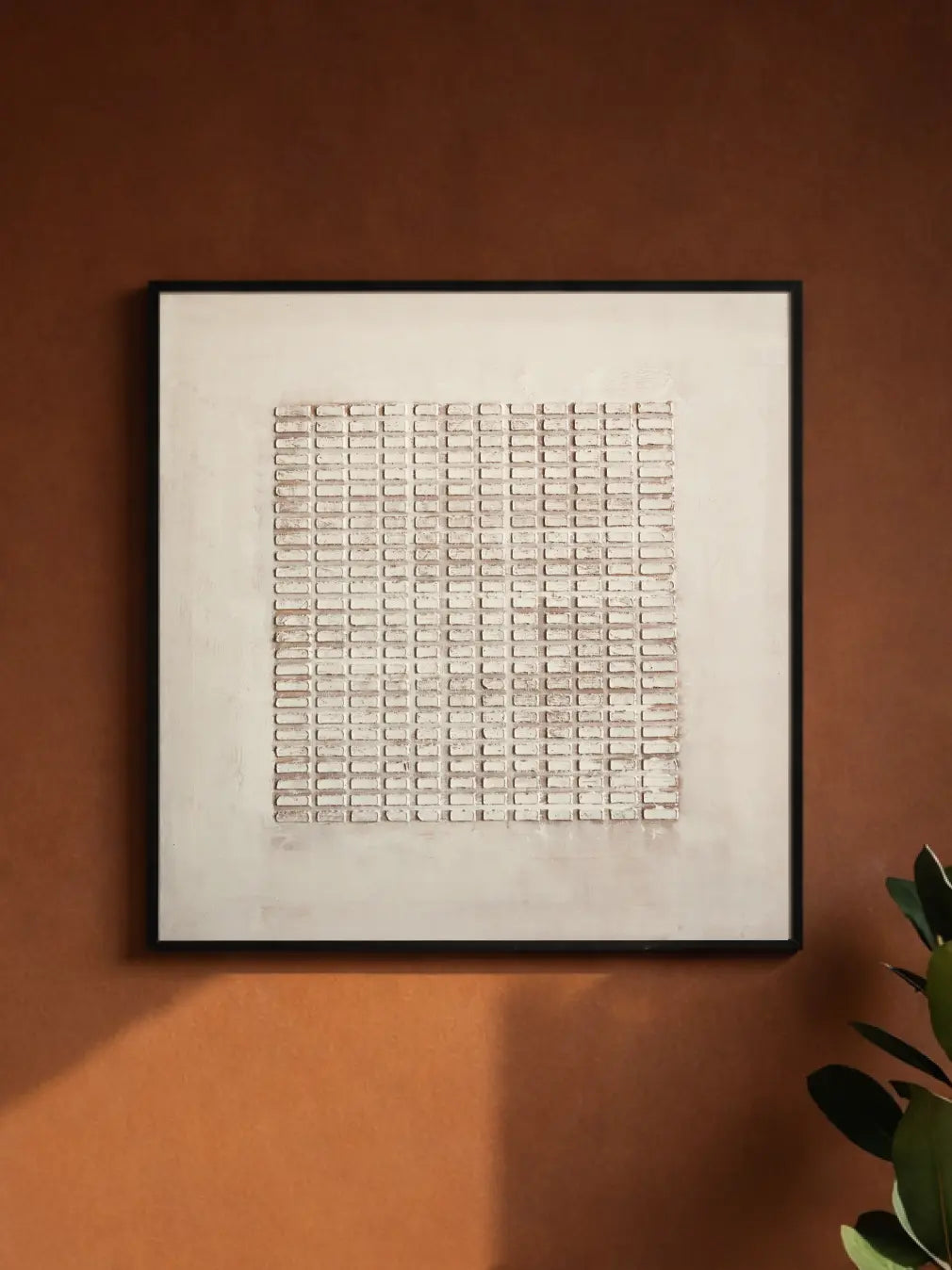 Beige 3D wall painting with textured plaster and black frame in a modern living room