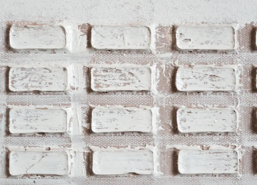 Close-up of hand-applied plaster texture on beige 3D wall art canvas