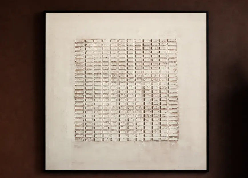 Textured filled wall painting with black frame styled on a warm brown wall