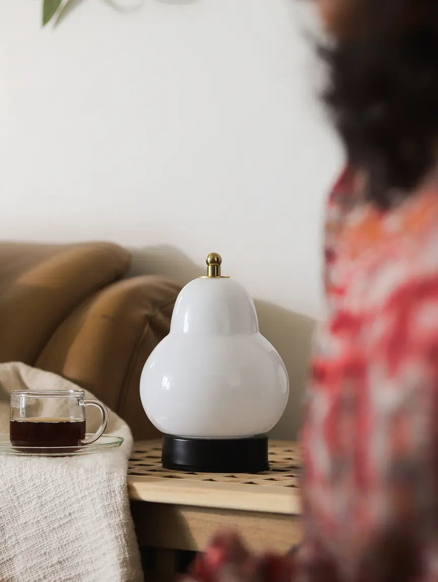 Pear Table Lamp styled on a side table in a modern living room