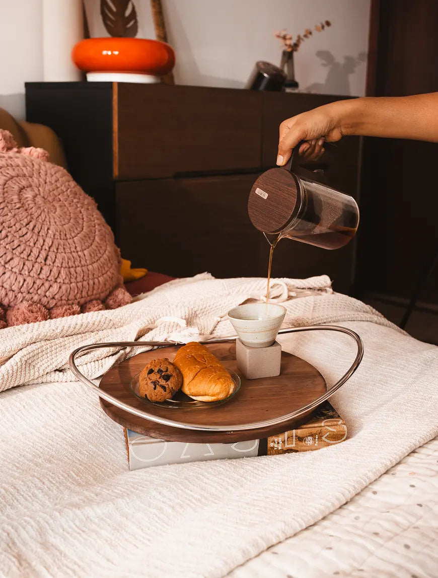 Breakfast in bed styled with premium wooden tray and snacks