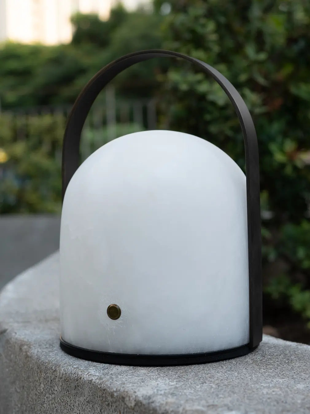 Arcus white marble portable table lamp with black arched metal handle