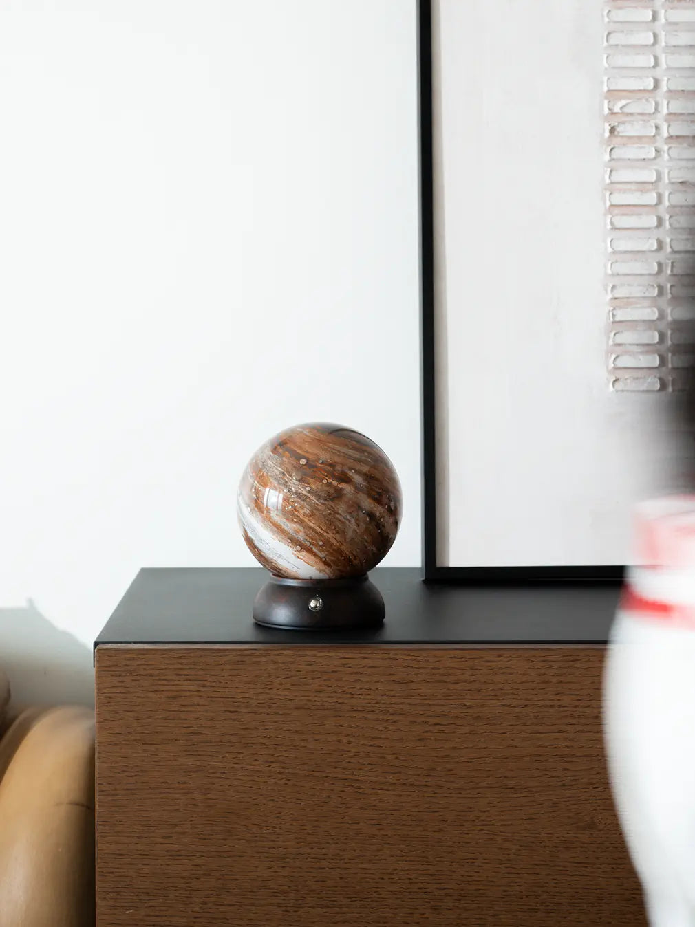 Cosmo glass portable table lamp styled on a modern bedside table
