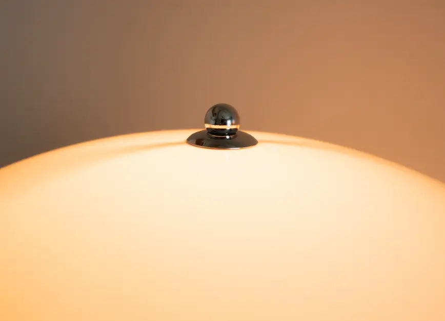 Nova white floor lamp dome shade with a polished metal crown detail