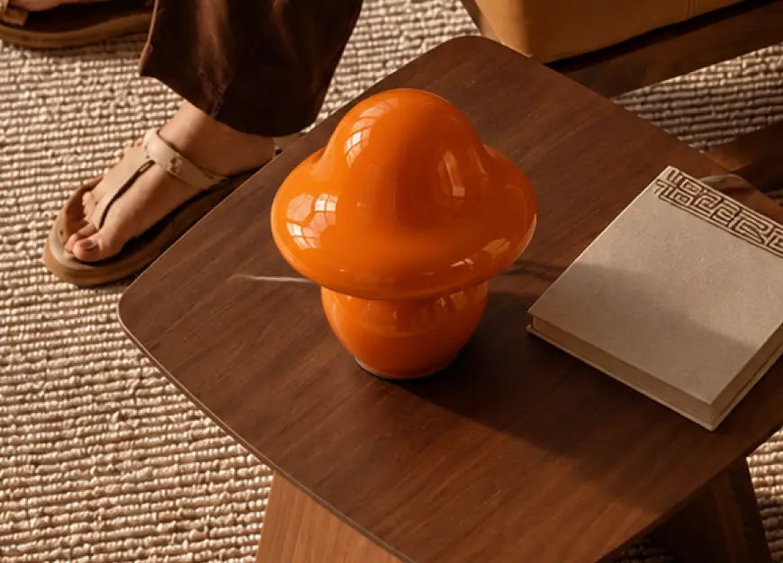 Mini Mushroom Orange Glass Table Lamp styled on a wooden side table